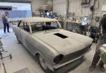 001 1963 Chevy Nova body in primer at shop roof masked hood cutout