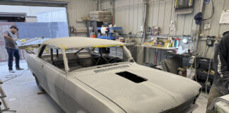 001 1963 Chevy Nova body in primer at shop roof masked hood cutout