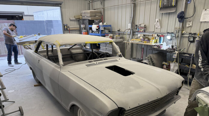 001 1963 Chevy Nova body in primer at shop roof masked hood cutout