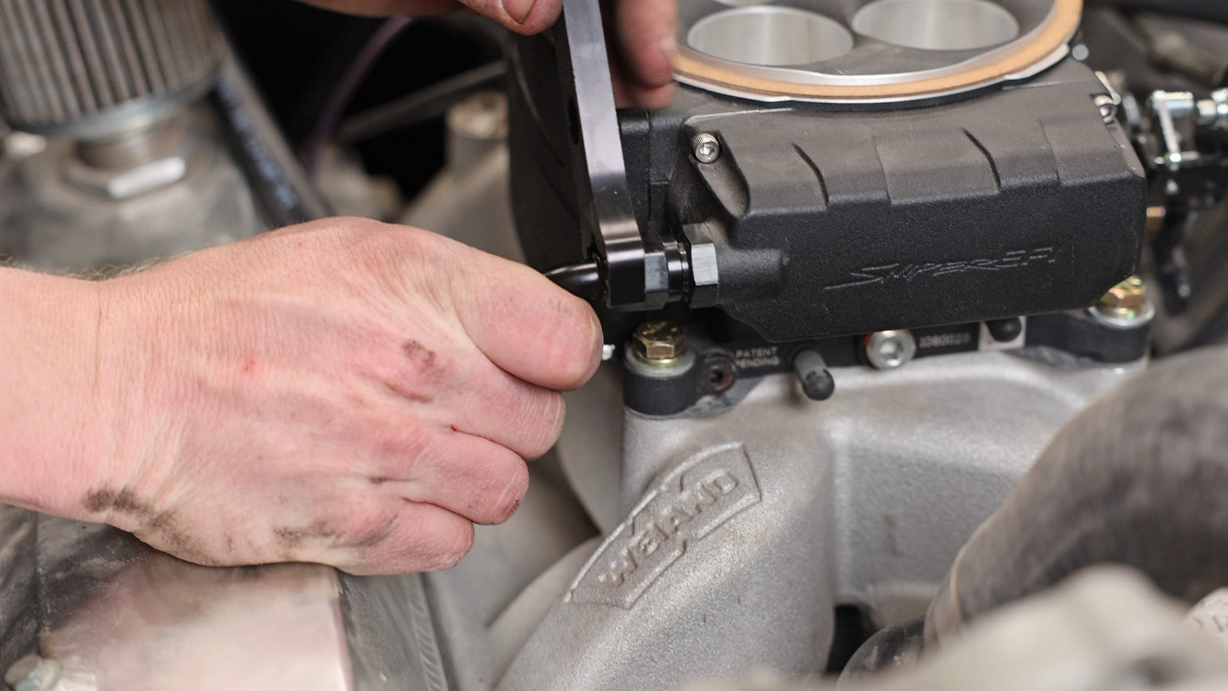 003 Tightening AN fitting on Sniper EFI fuel inlet using aluminum wrench