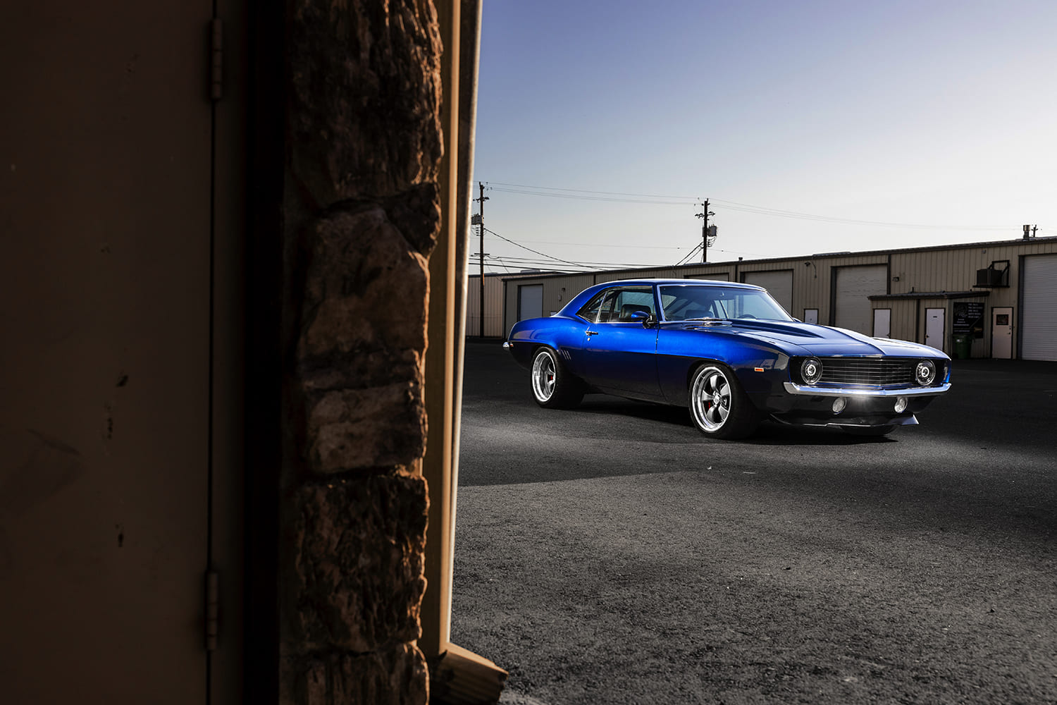 006 1969 Chevy Camaro street shot blue paint shop background evening glow