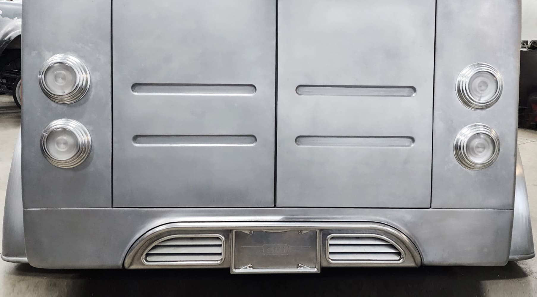 01 Divco custom rear double door tail section with quad taillights and louvered panels in raw aluminum