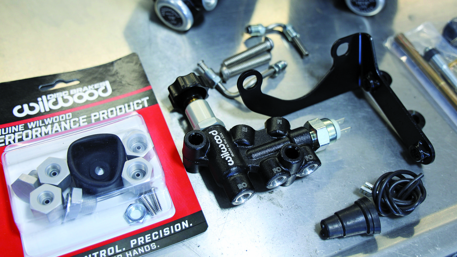 010 Wilwood brake proportioning valve kit and fittings laid out