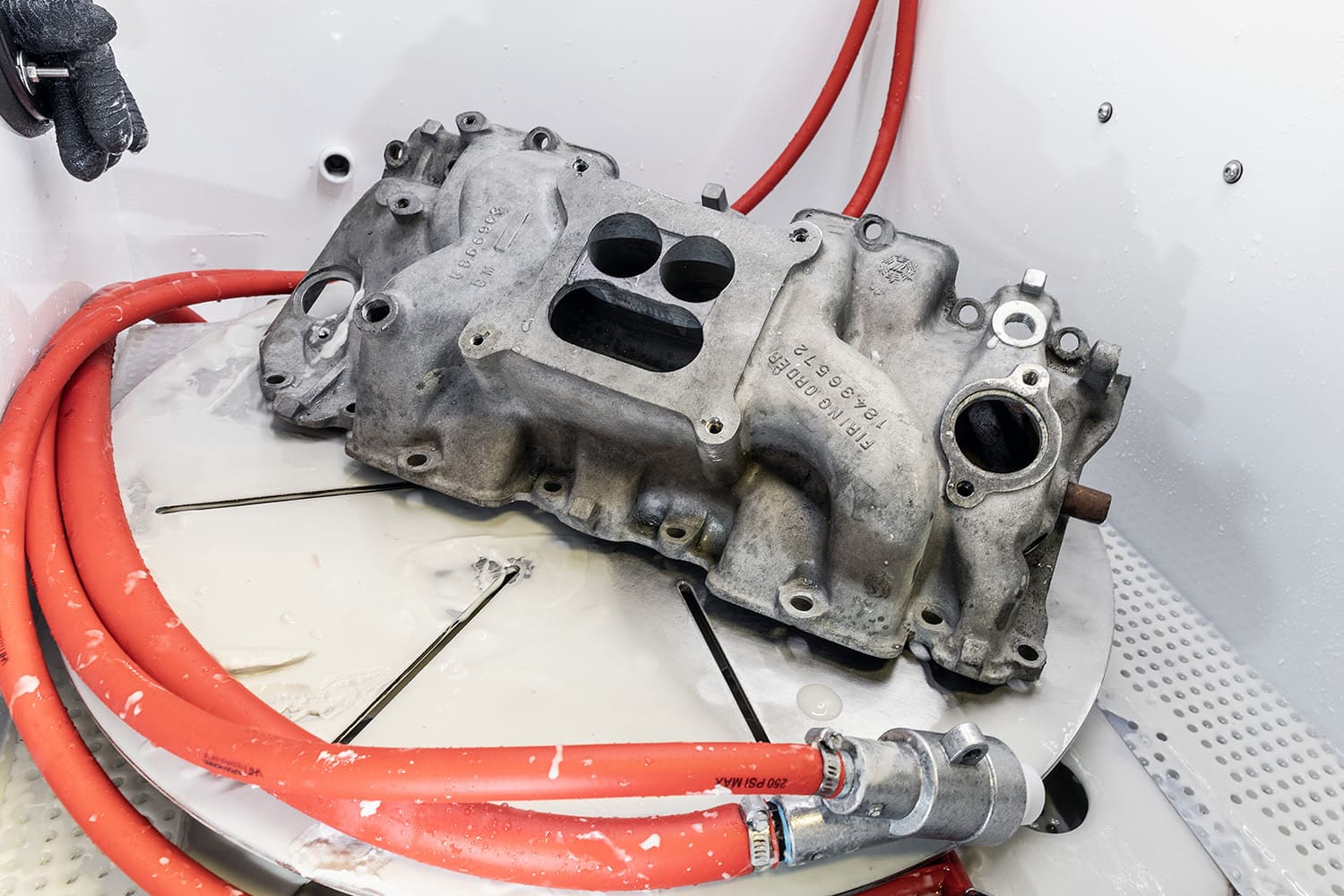 010 intake manifold inside vapor blasting cabinet pre cleaning