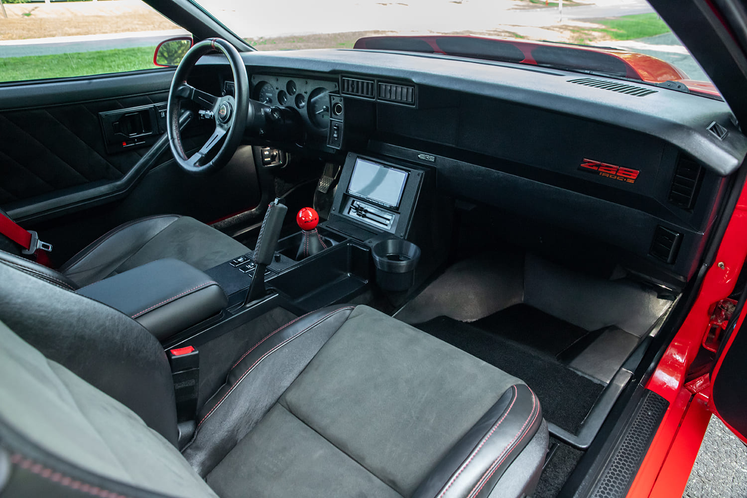 011 1988 IROC Z Camaro custom interior Z28 dash badge suede seats red stitching