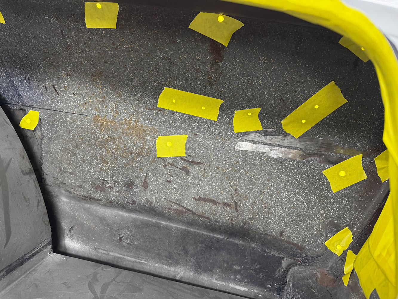 017 Inner trunk panels of 1963 Chevy Nova masked for detail work