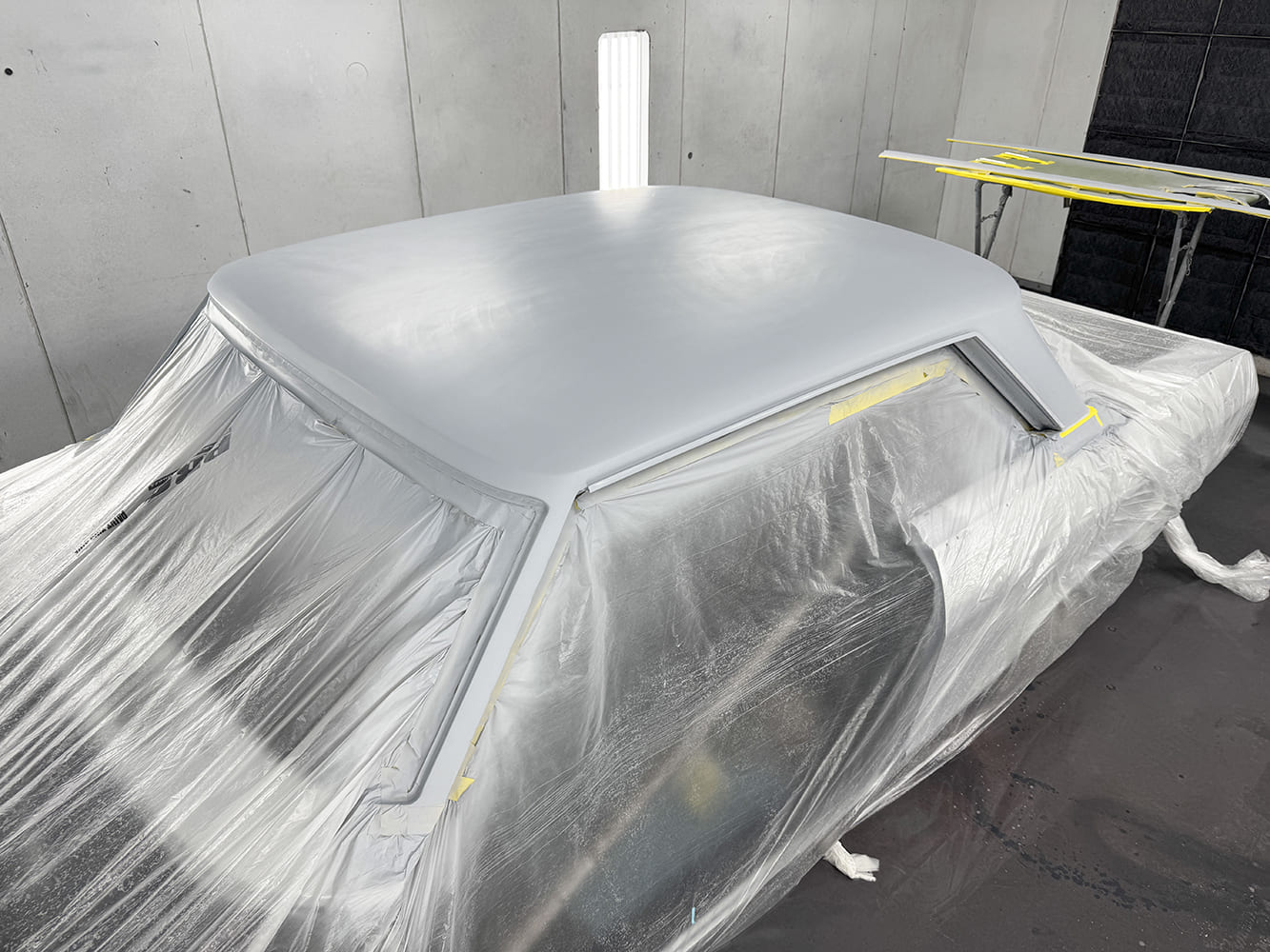 019 1963 Chevy Nova roof freshly primed panels masked in booth