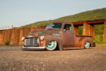 02 1948 GMC truck slammed front view rusty patina teal wheels classic pickup