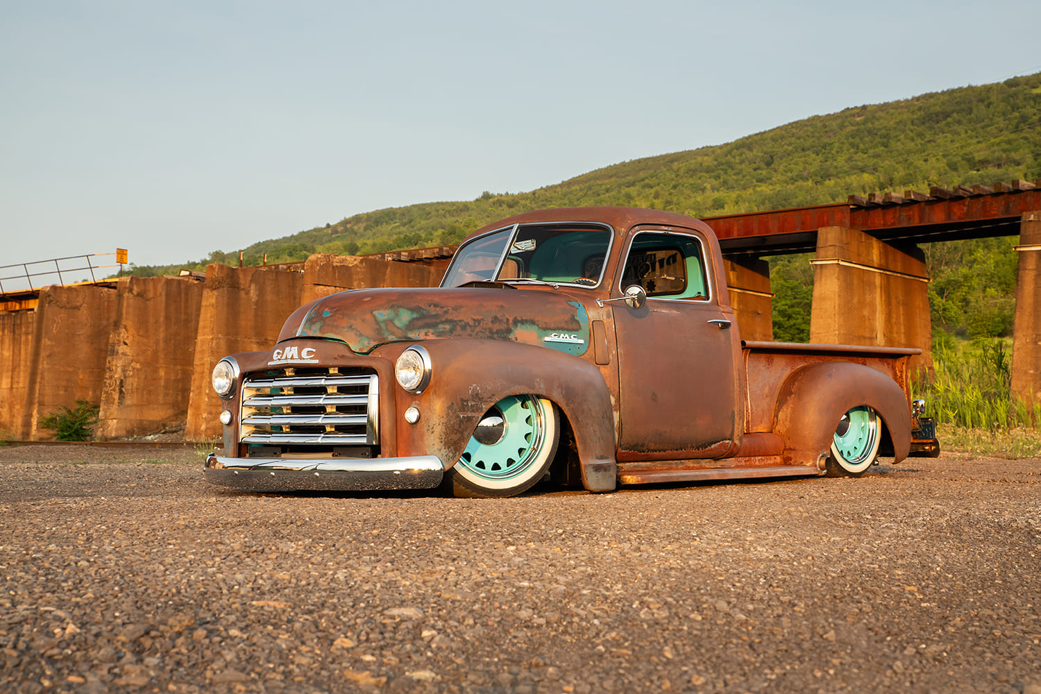 02 1948 GMC truck slammed front view rusty patina teal wheels classic pickup