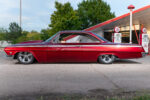 02 1962 Chevy Impala driver side full view tucked stance classic Vickers gas station backdrop
