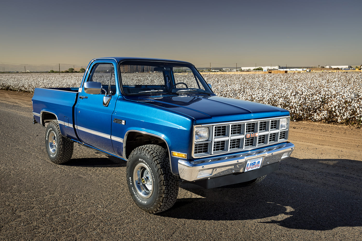 02 1981 gmc k15 angled front three quarter shot blue paint bf goodrich tires