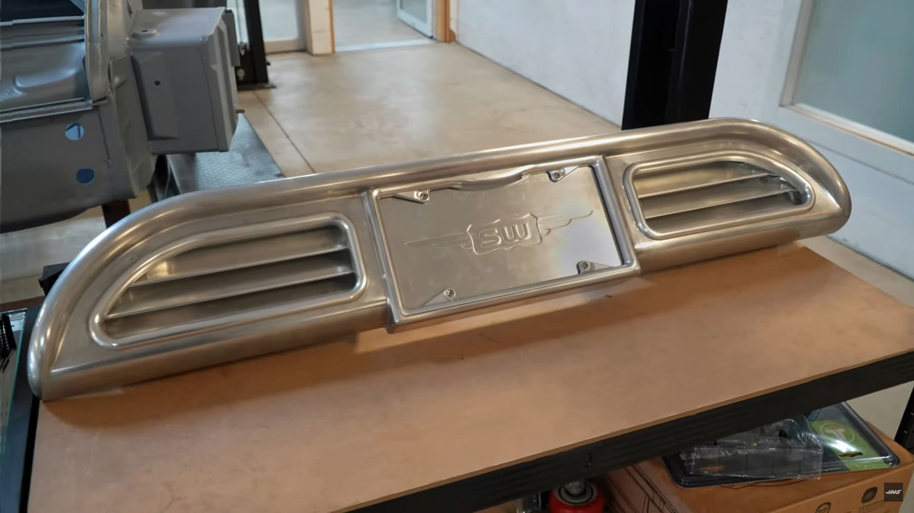02 Divco custom rear license panel with billet vents and SW logo plate mount in hand formed metal