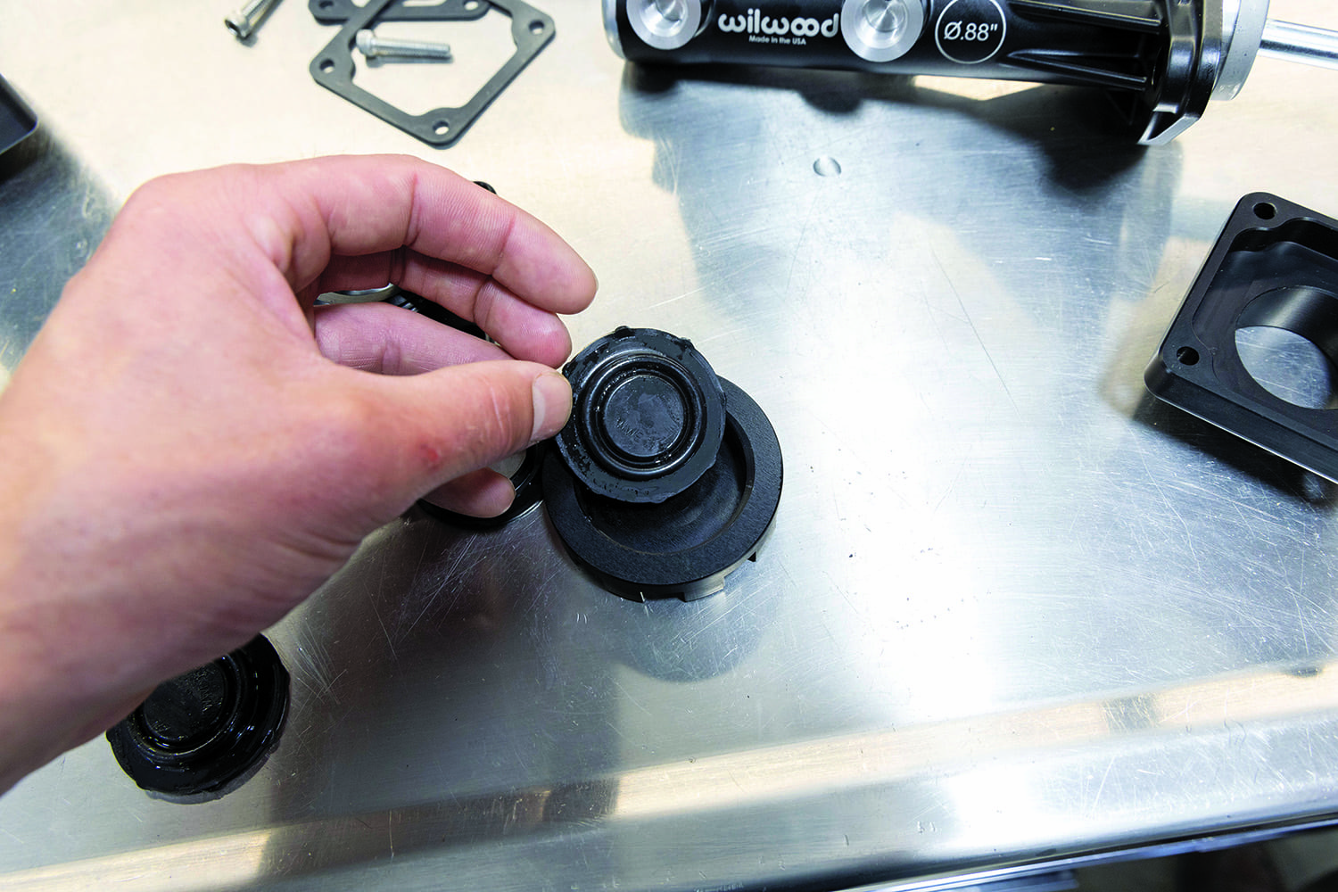 025 Wilwood reservoir cap diaphragm seal removed for inspection