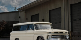 03 1966 Chevrolet Suburban three quarter profile with custom wheels lowered suspension and clean body panels