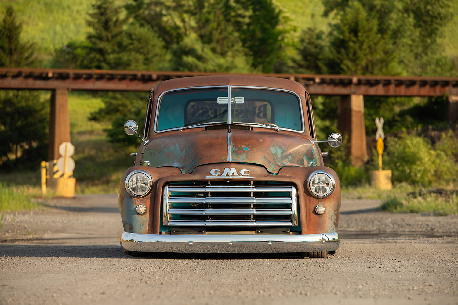 04 1948 GMC truck front view patina grille lowered stance rustic setting