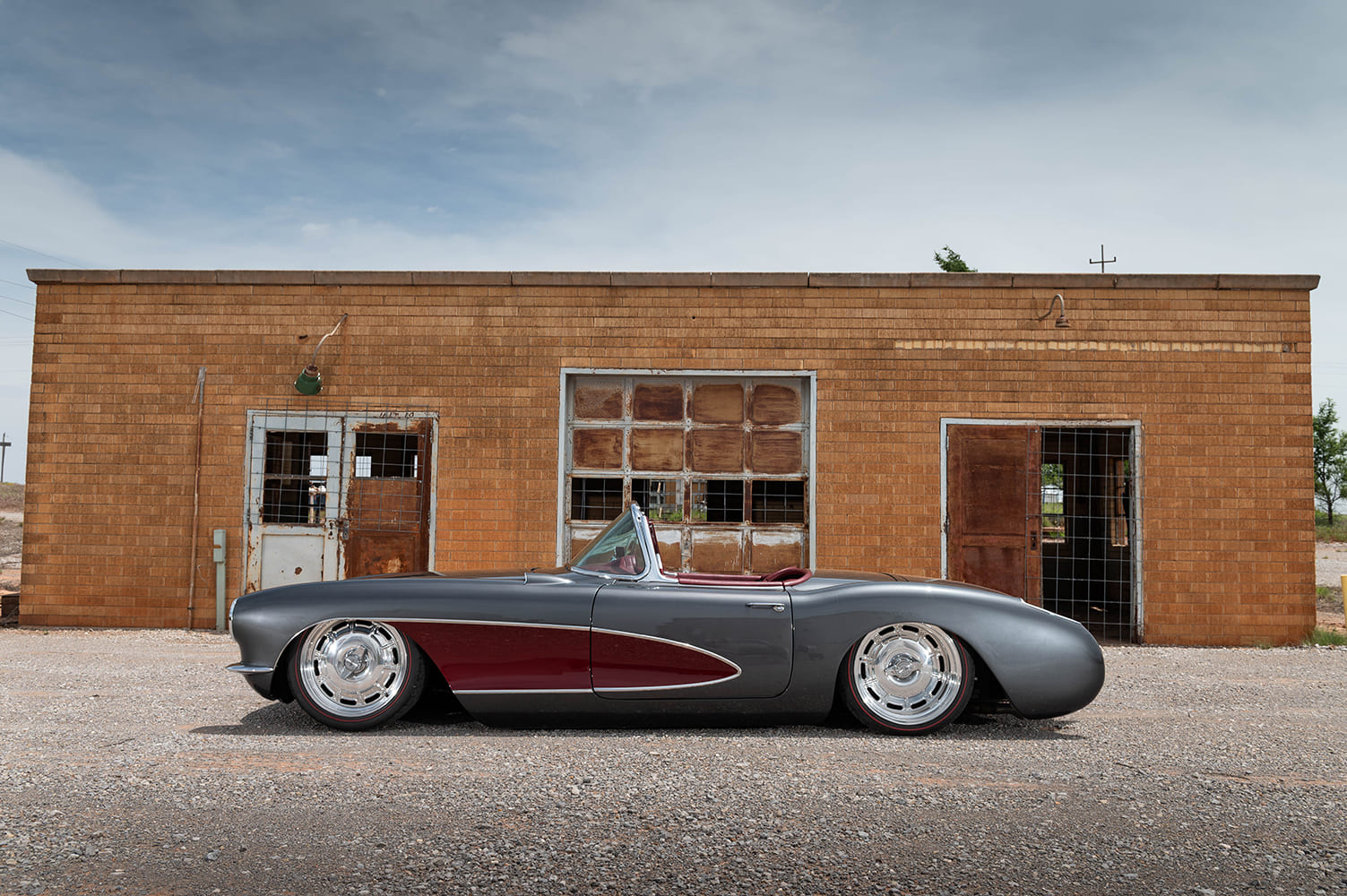 04 1956 Corvette C1 parked side profile smooth body lines and tucked stance with modernized trim