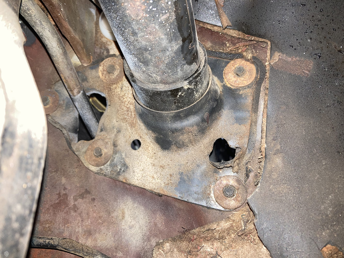 04 1964 Pontiac GTO column base firewall hole enlarged and worn for tilt column clearance