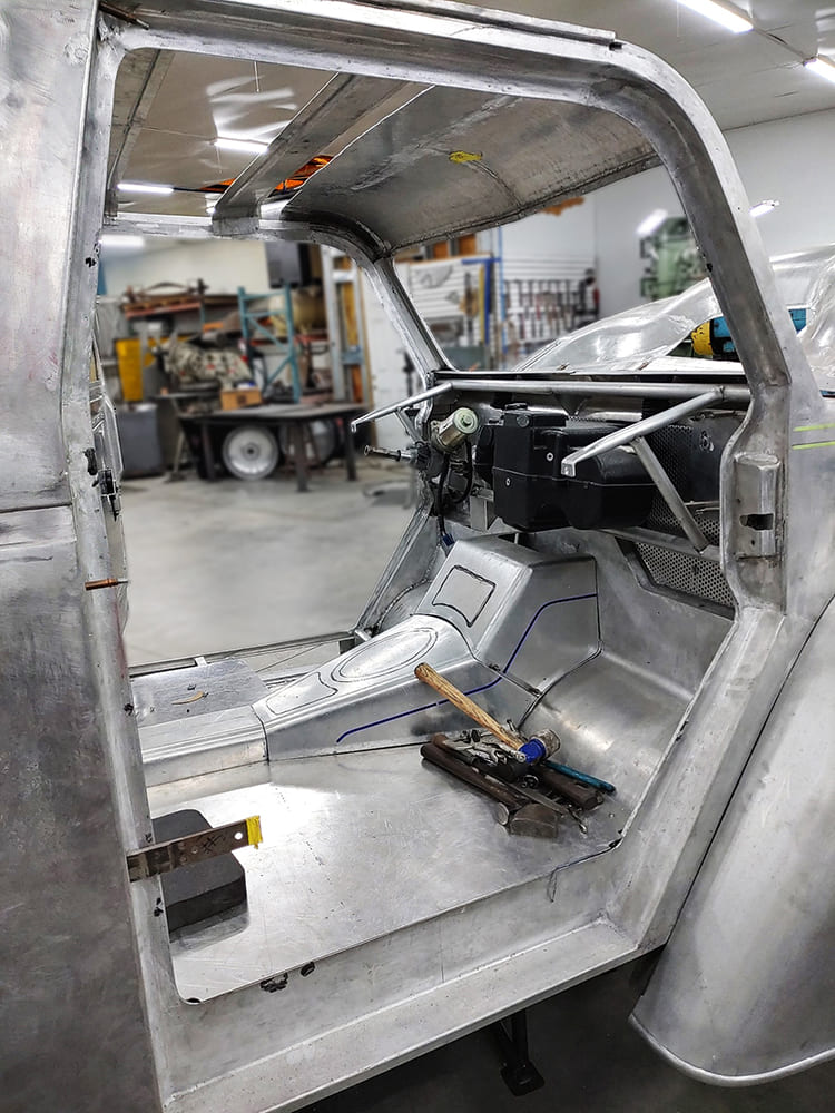 04 Divco custom interior bare floor and tunnel mockup with early dash bar and firewall detail