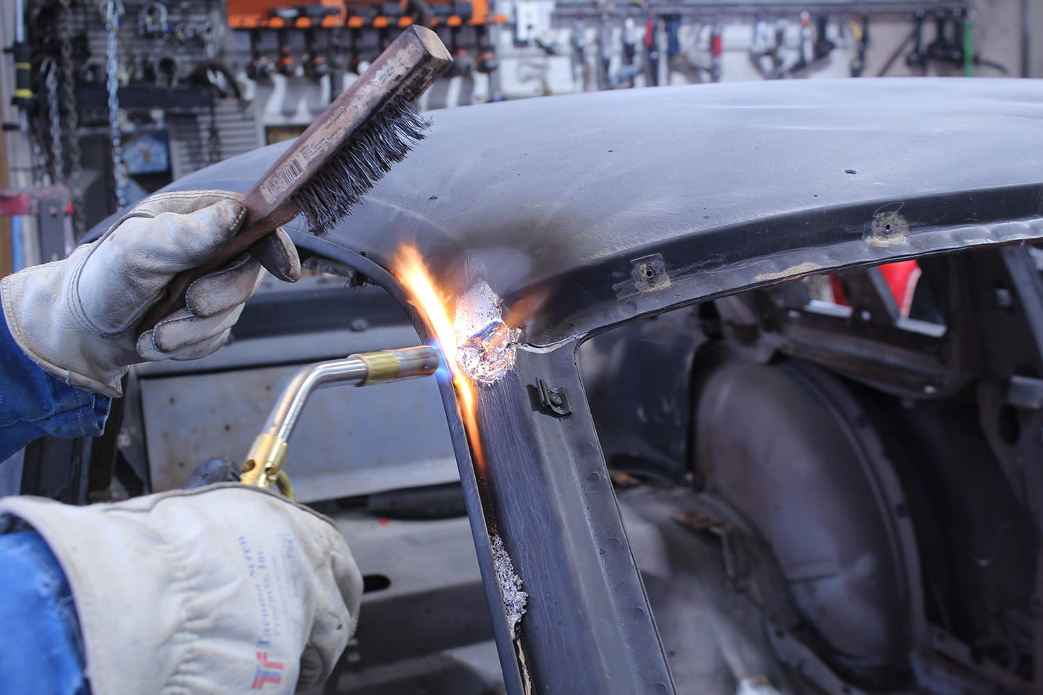 04 Heat and a wire brush used to soften lead seams during roof skin separation