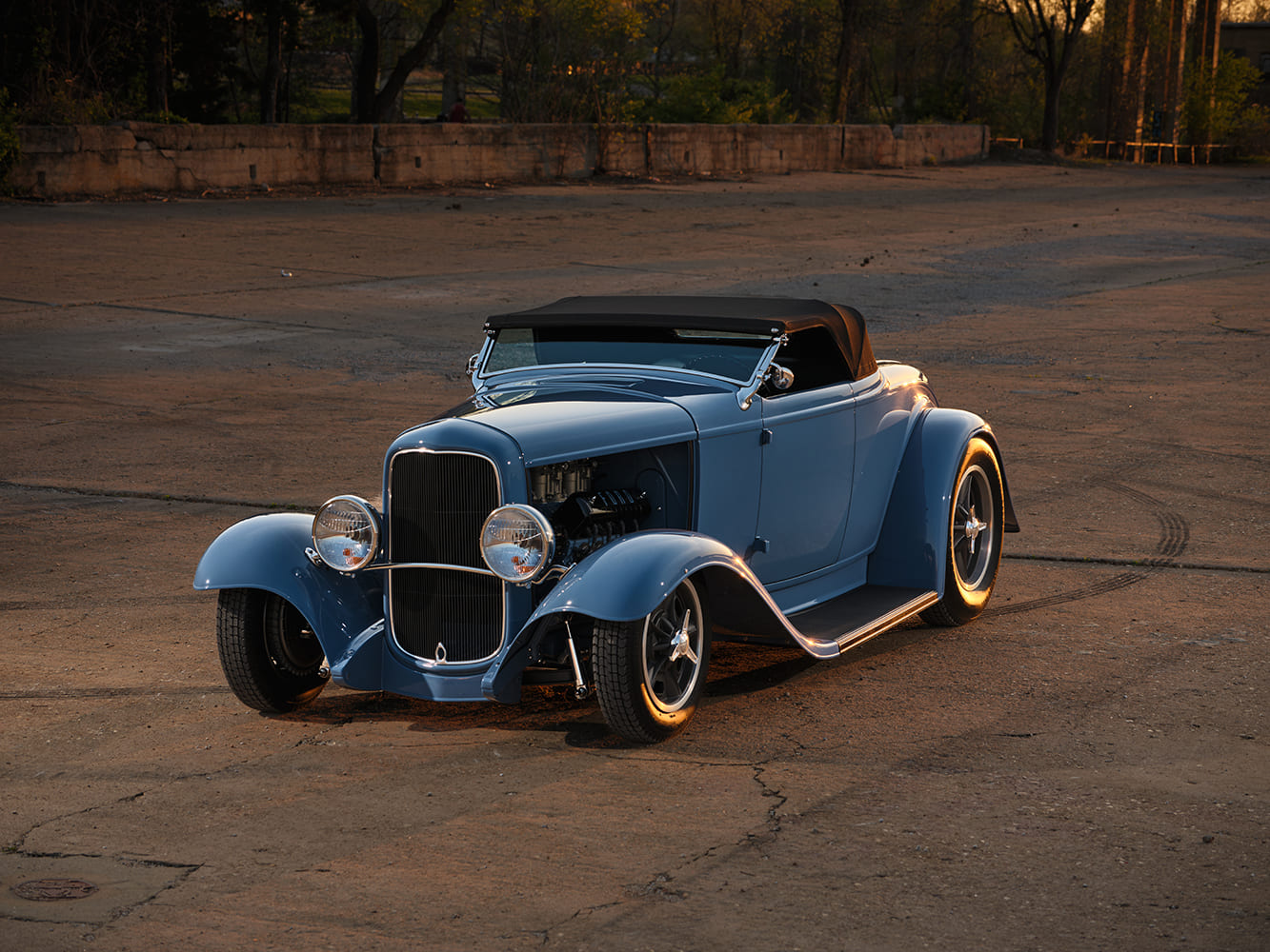 05 1932 Ford Roadster blue body black soft top five spoke wheels sunset shot