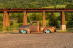 05 1948 GMC truck profile shot bagged suspension teal wheels rust finish