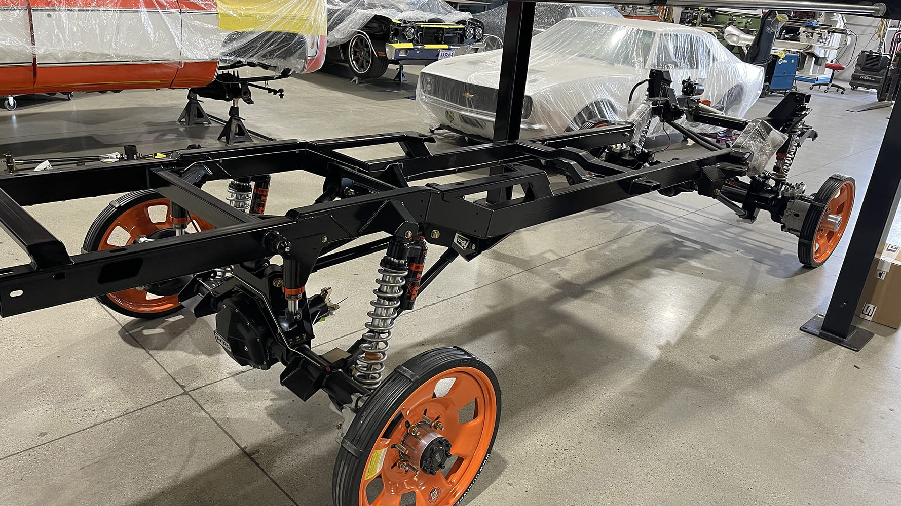 05 1985 chevy squarebody rtech chassis roller with orange wheels and dual fox coilovers