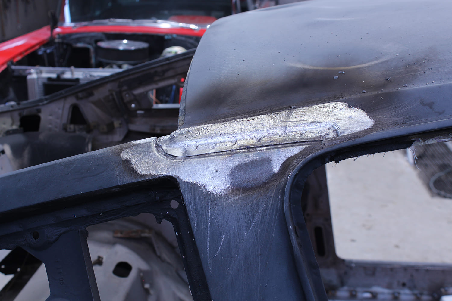 05 Exposed seam along the roof to A pillar joint after grinding back filler and lead