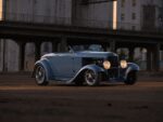 06 1932 Ford Roadster blue fendered body warm headlights downtown industrial backdrop