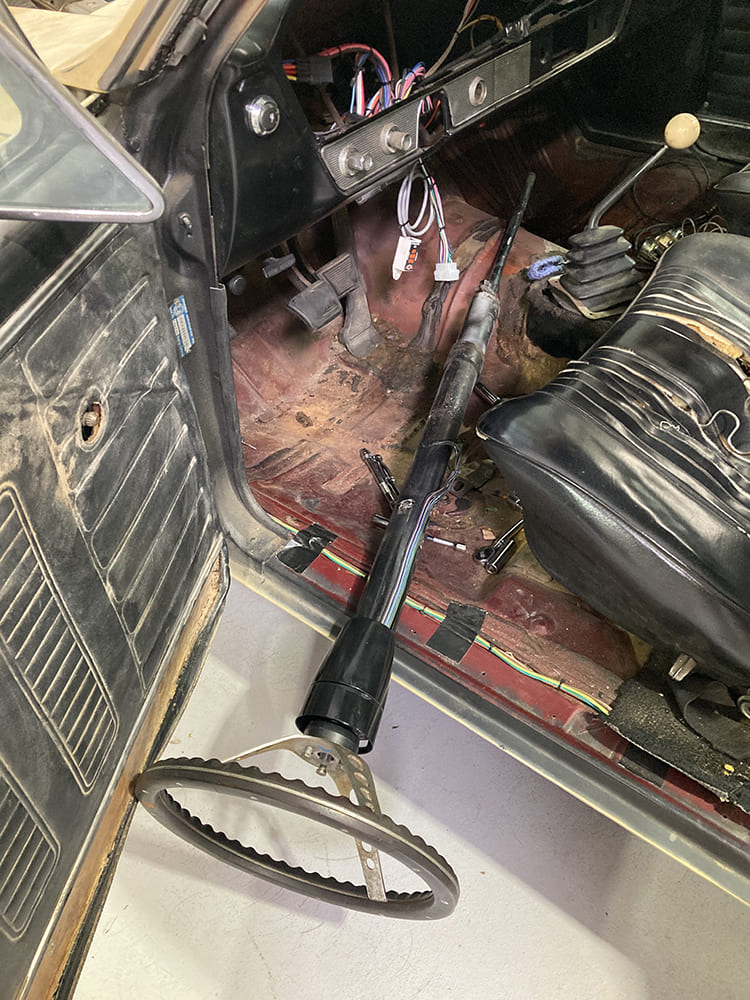 06 1964 Pontiac GTO removed factory tilt column showing full shaft and weathered steering wheel