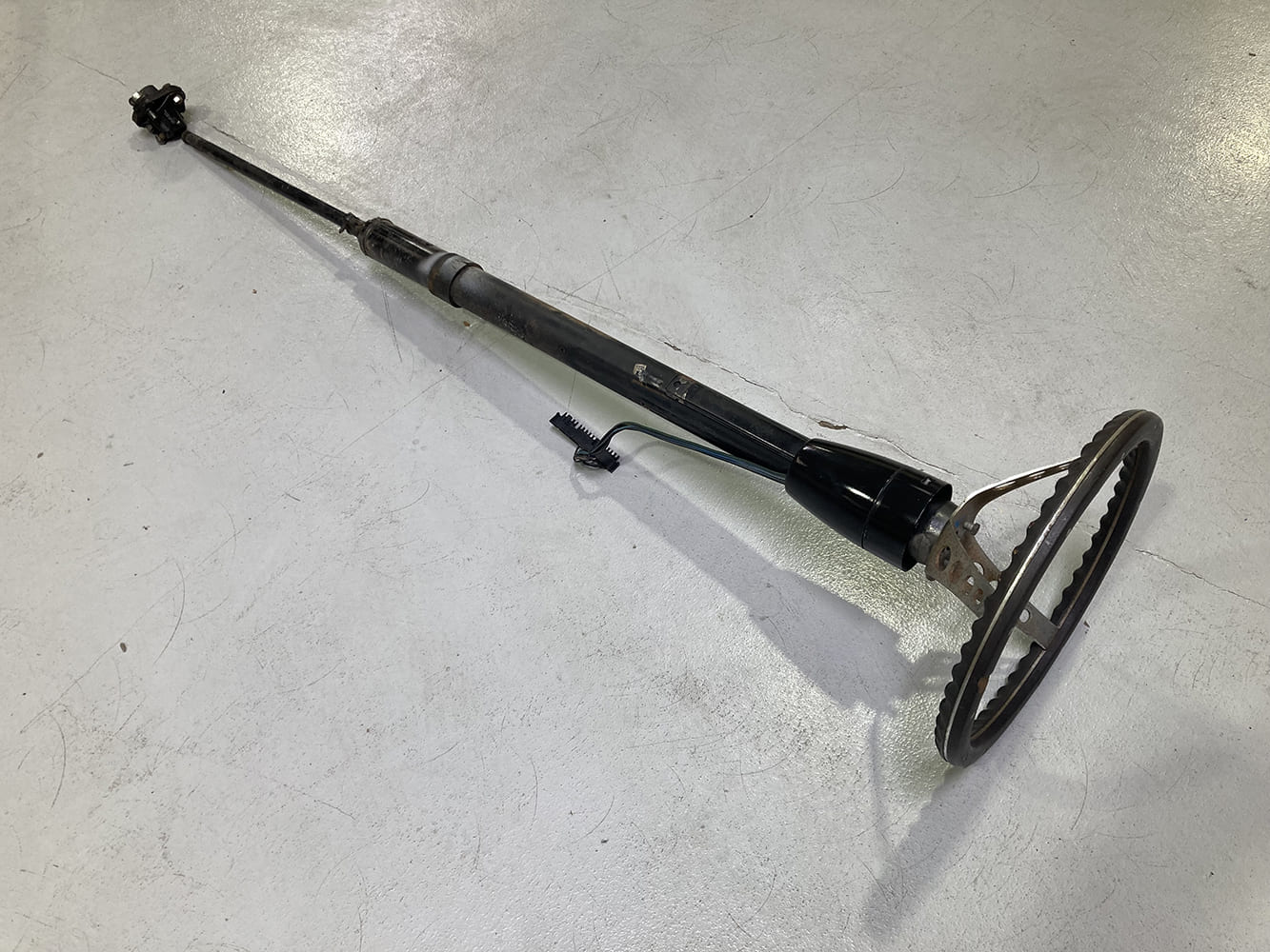 07 1964 Pontiac GTO OEM steering coupler rag joint removed and set on floor for replacement