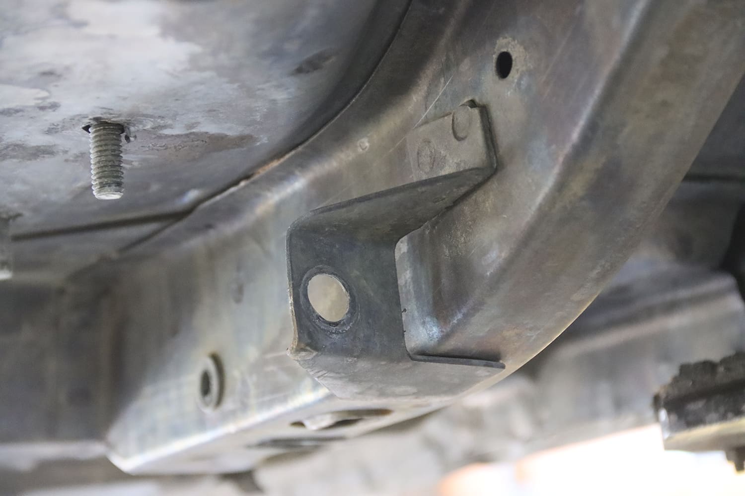 07 1967 Pontiac Firebird underbody view of original frame rail mounts with bracing and welds visible