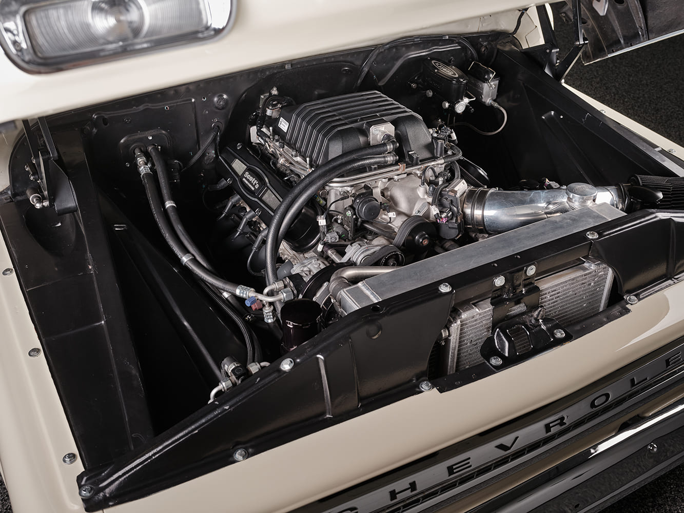 08 1966 Chevrolet Suburban engine bay with supercharged LS engine black accents and custom plumbing
