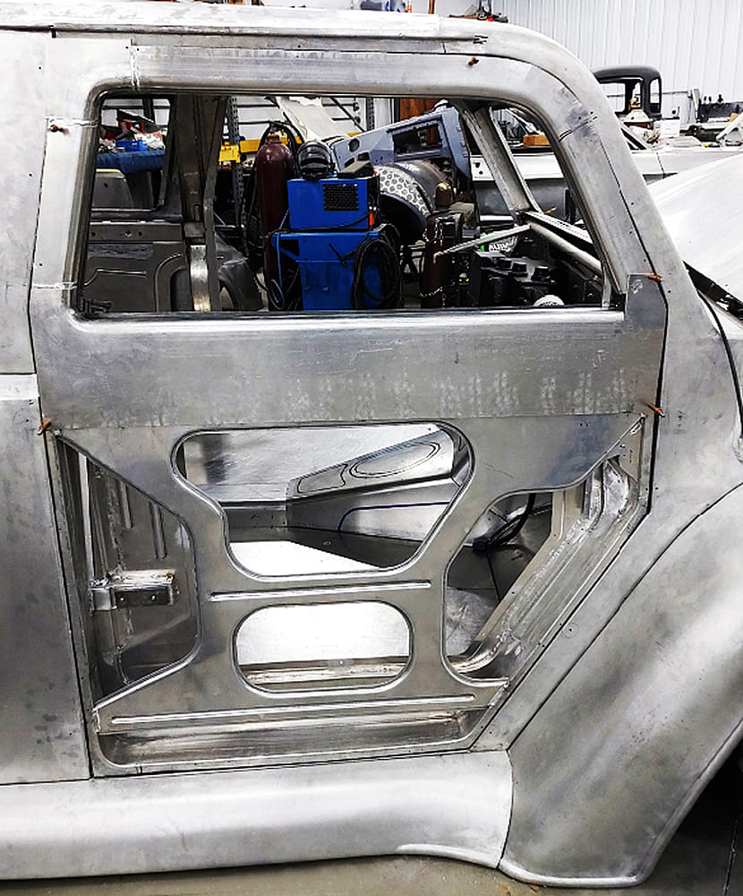 09 Divco custom passenger door framework mid fabrication showing welds channeling and reinforcement ribbing