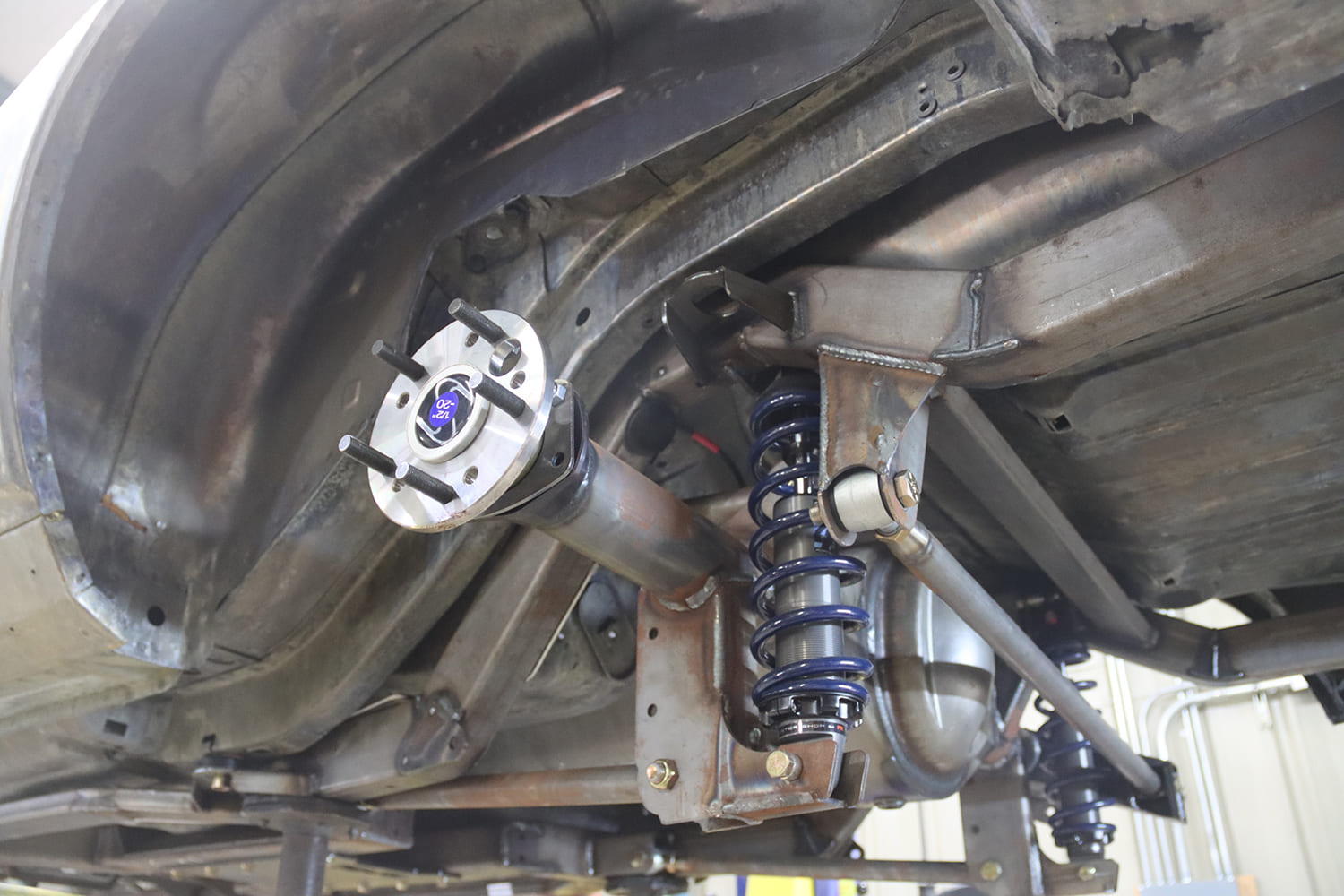 10 1967 Pontiac Firebird rear corner showing mini tub clearance coilovers and Detroit Speed rear setup