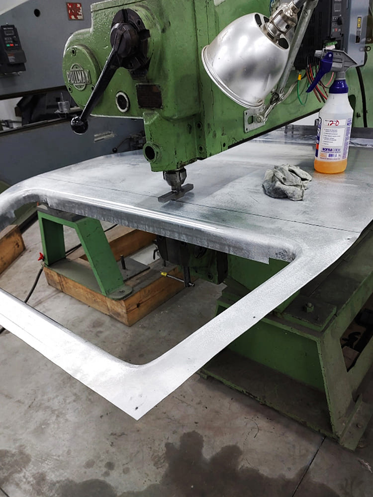 10 Divco custom upper door frame shaped on Pullmax machine with bead detail in raw aluminum