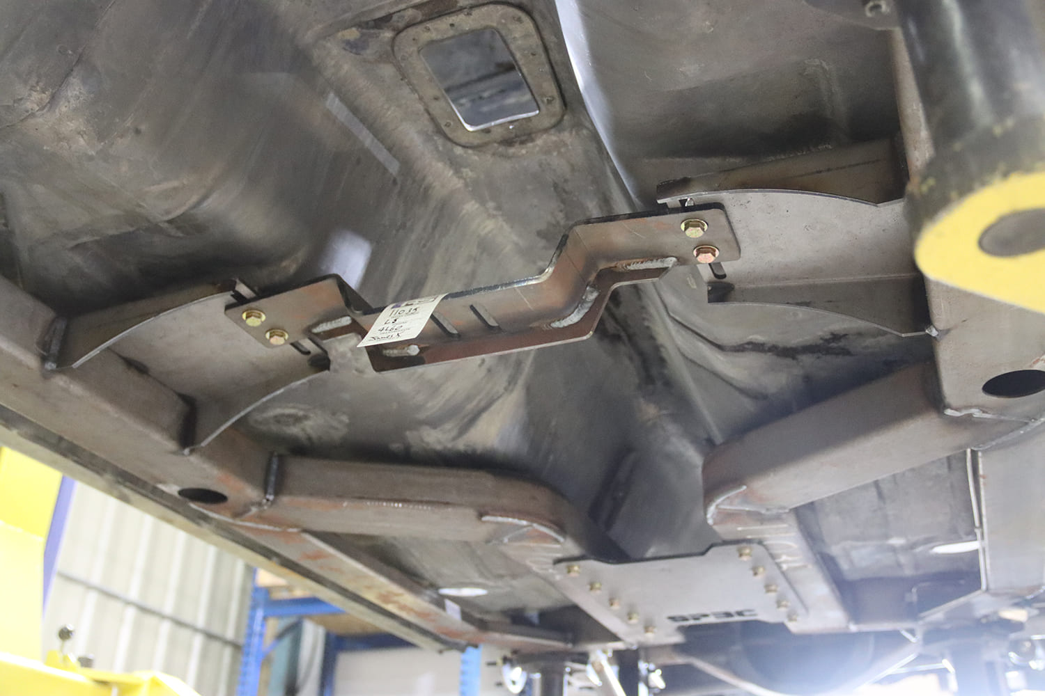 11 1967 Firebird floor support crossmember welded with reinforcement plates and tunnel notch for driveshaft clearance