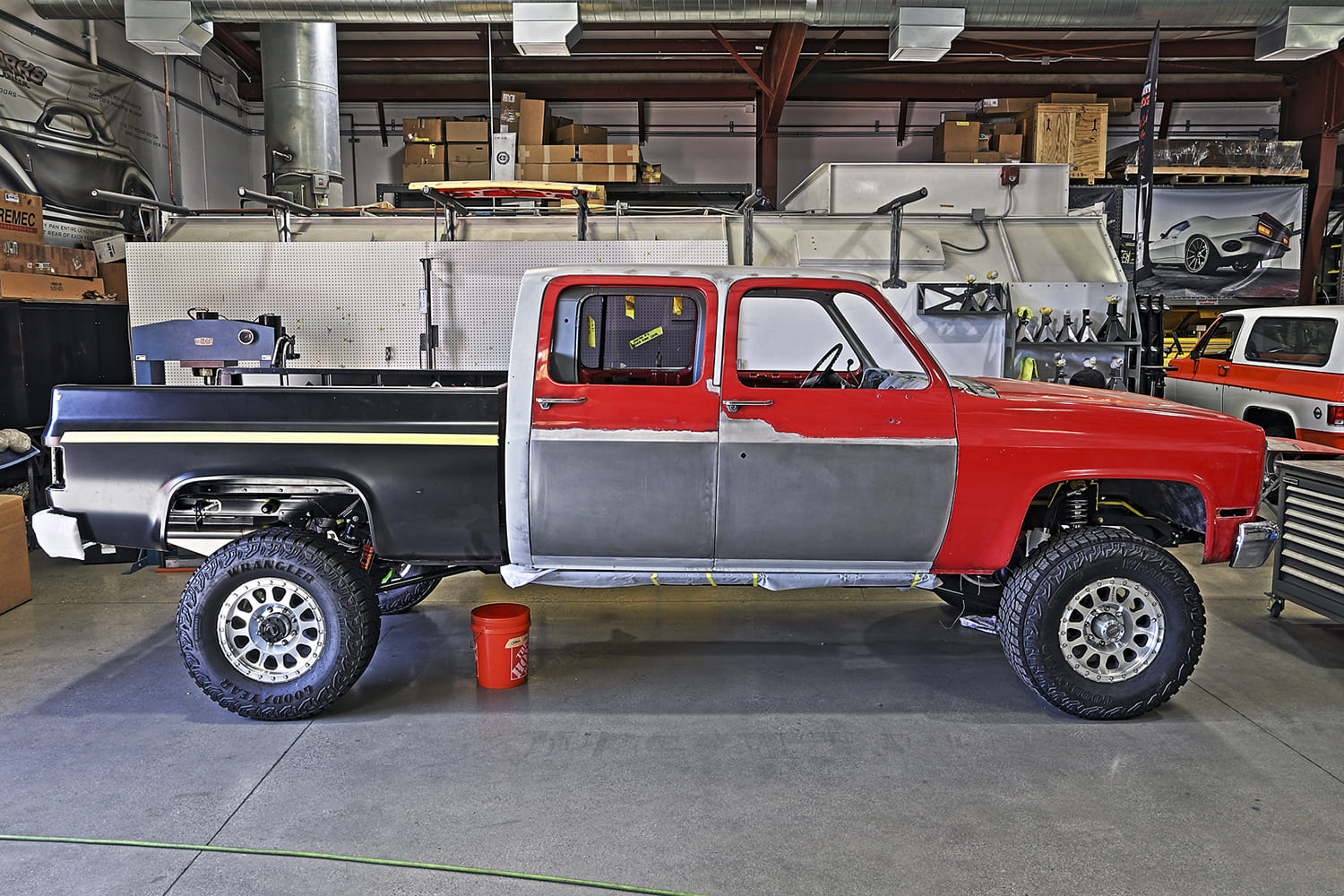11 1985 chevy squarebody crew cab mid build with raw panels red cab and goodyear wrangler off road tires