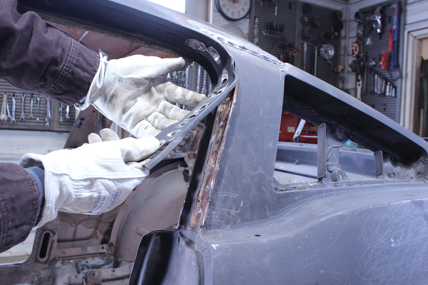 11 Rusted drip rail trim is removed from the 1965 Mustang Fastback A pillar channel