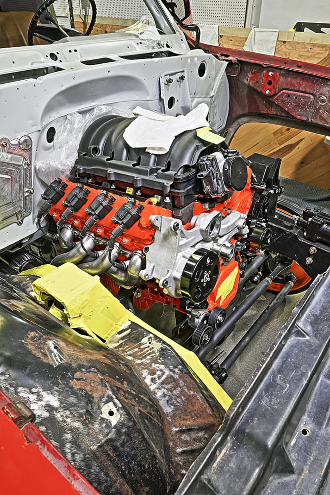 12 1985 chevy squarebody ls engine install in primered engine bay with headers and serpentine front drive