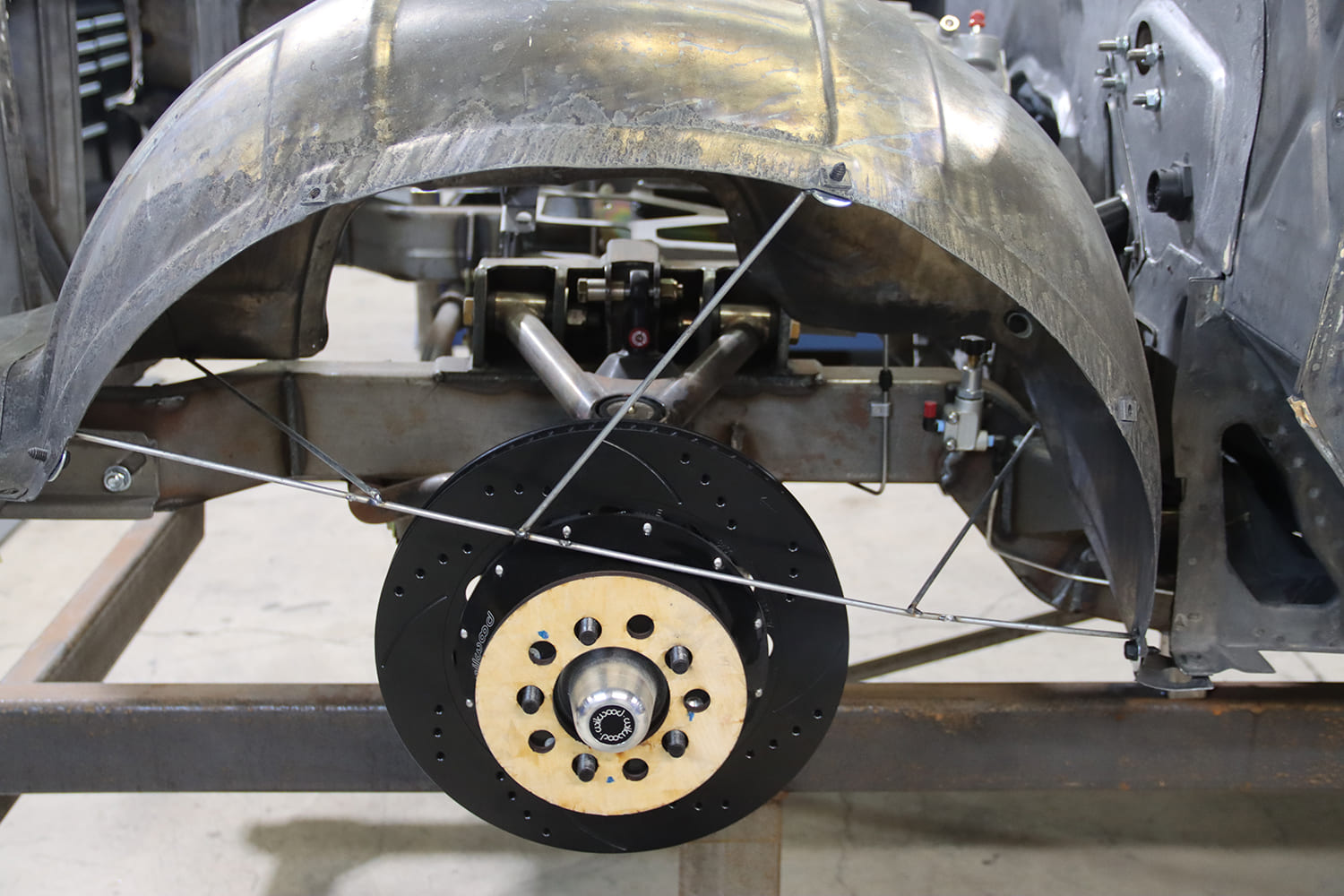 13 1967 Firebird rear mockup with Wilwood disc brake link bars and tubbed fender for wheel clearance