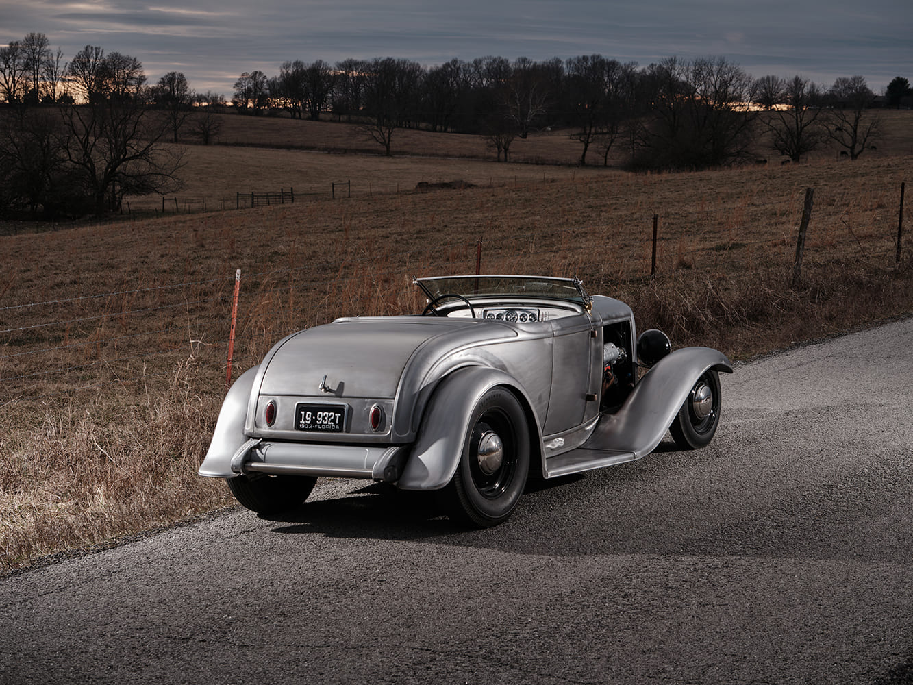 14 1932 Ford Roadster rear three quarter view raw steel black wheels nostalgia plates