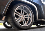 14 1955 Ford F 100 rear wheel close up American Racing polished wheels performance tires
