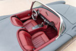 14 1956 Corvette interior bird’s eye view showing dual bucket seats and full red leather wrap