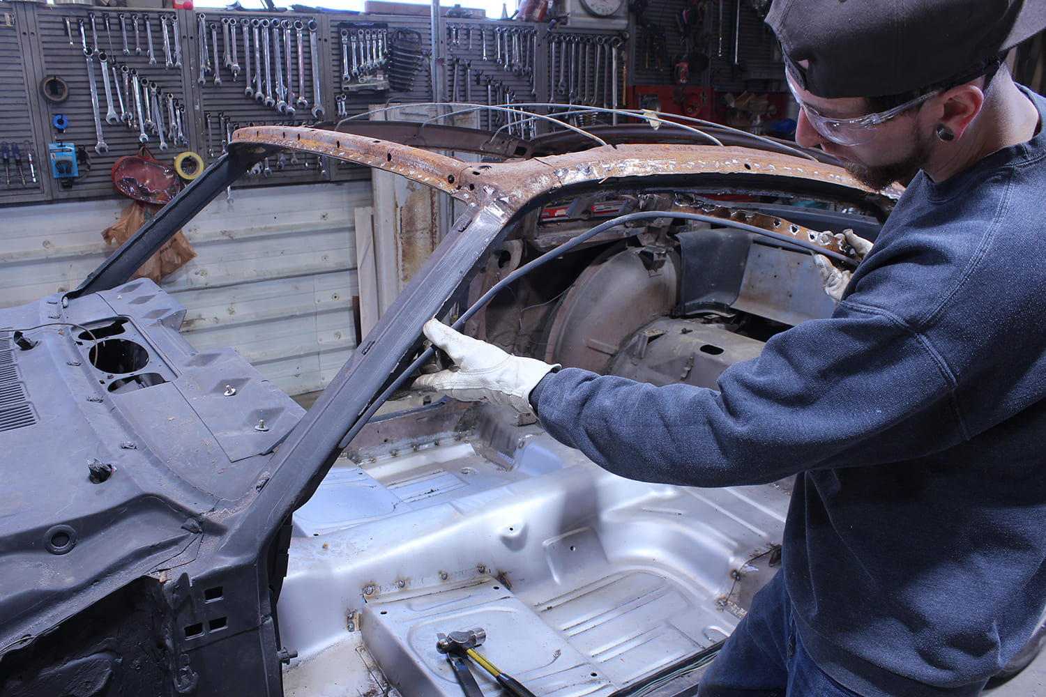 14 Inspection of inner A pillar reveals hidden rust and prior structural damage
