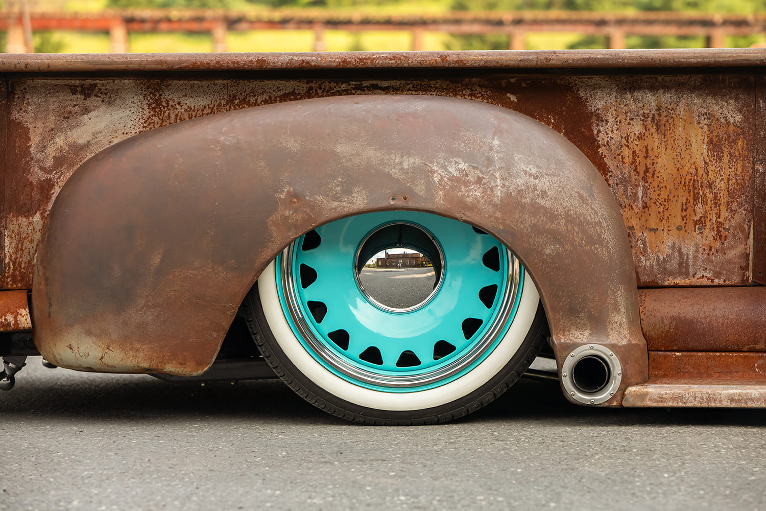 15 1948 GMC truck rear wheel closeup whitewall turquoise steelie patina fender