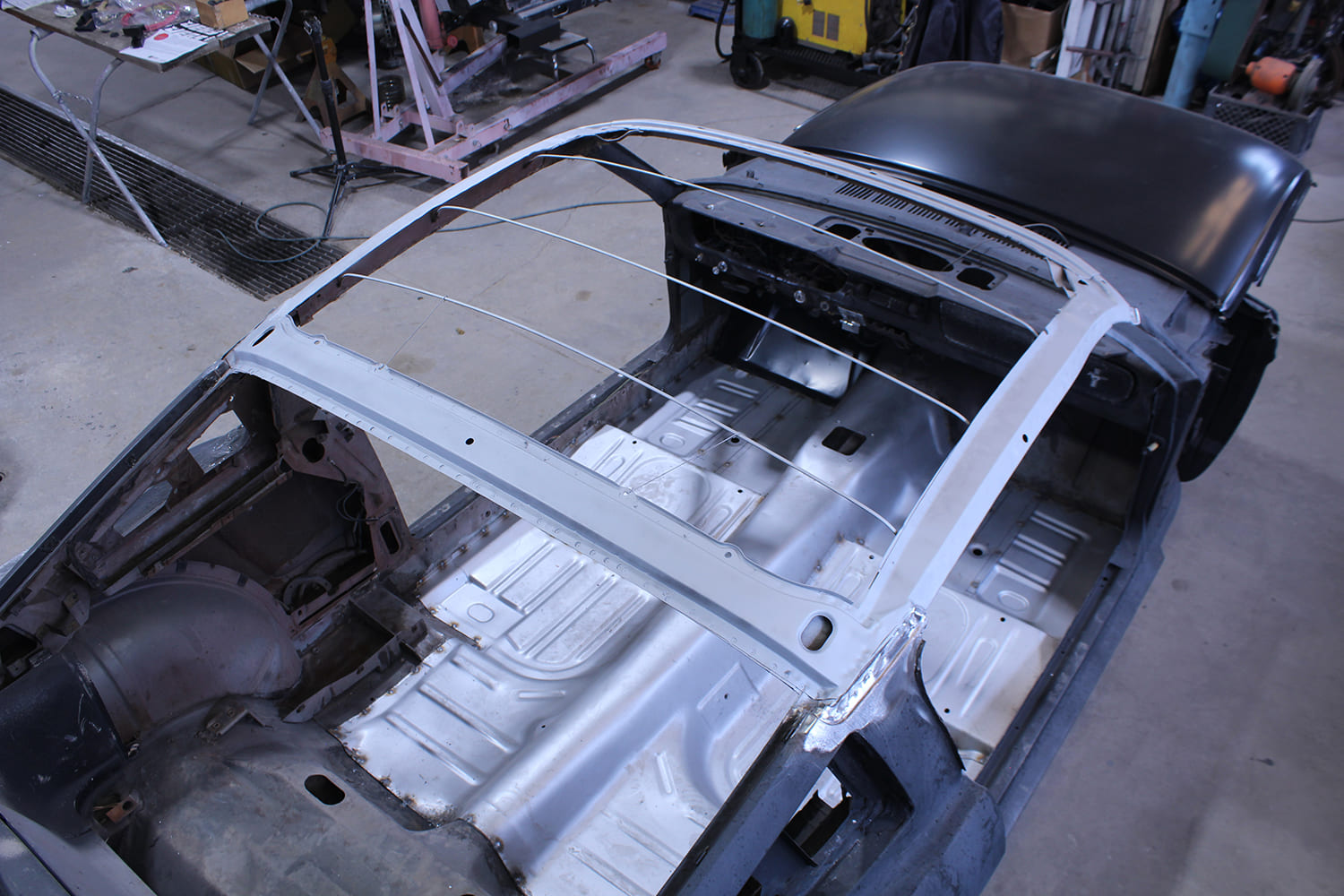 16 Roof bows and braces are prepped for the installation of the replacement panel