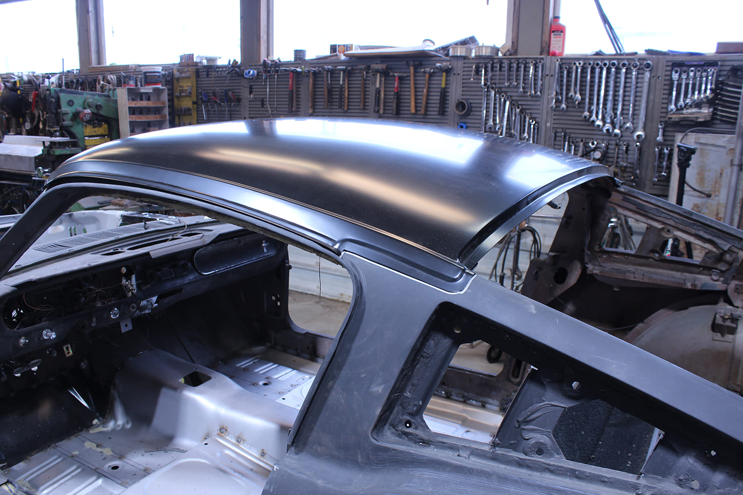 17 New black EDP coated roof skin test fitted on 1965 Mustang Fastback body
