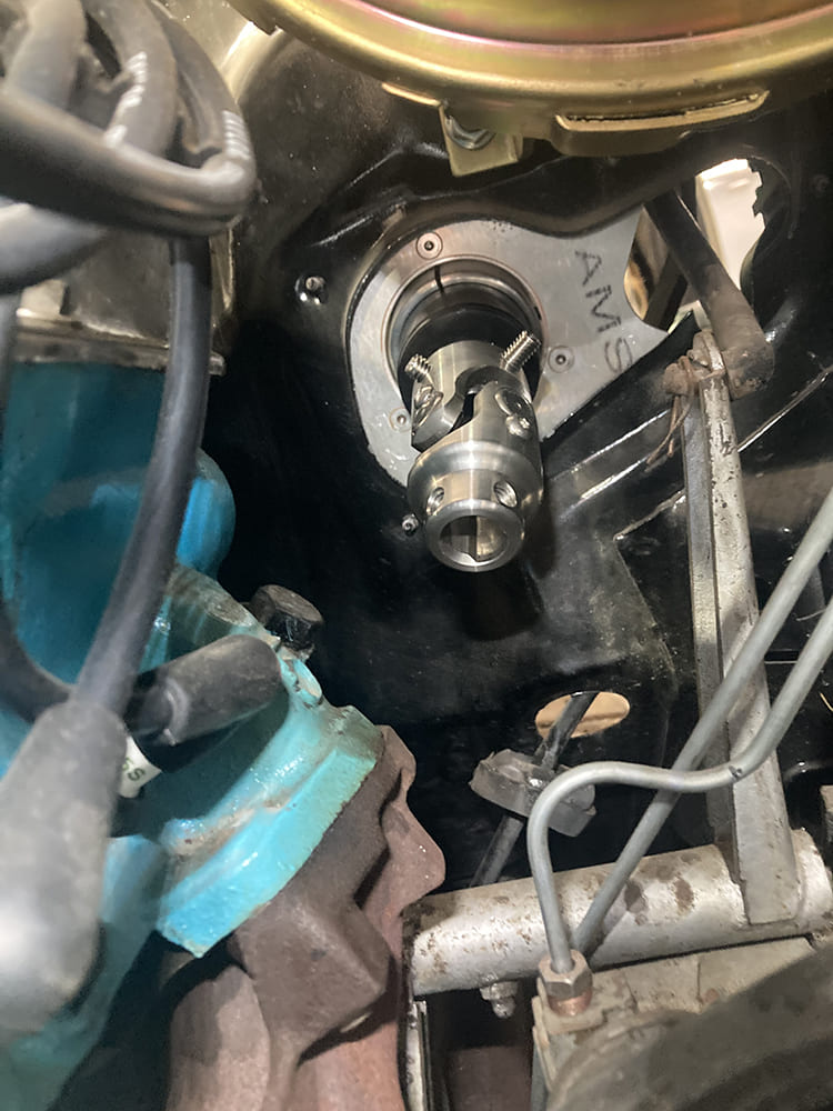 19 1964 Pontiac GTO engine bay shot with installed billet column plate and stainless U joint at firewall
