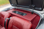 21 1956 Corvette custom rear speaker enclosure with red leather wrap and plexiglass window behind seats