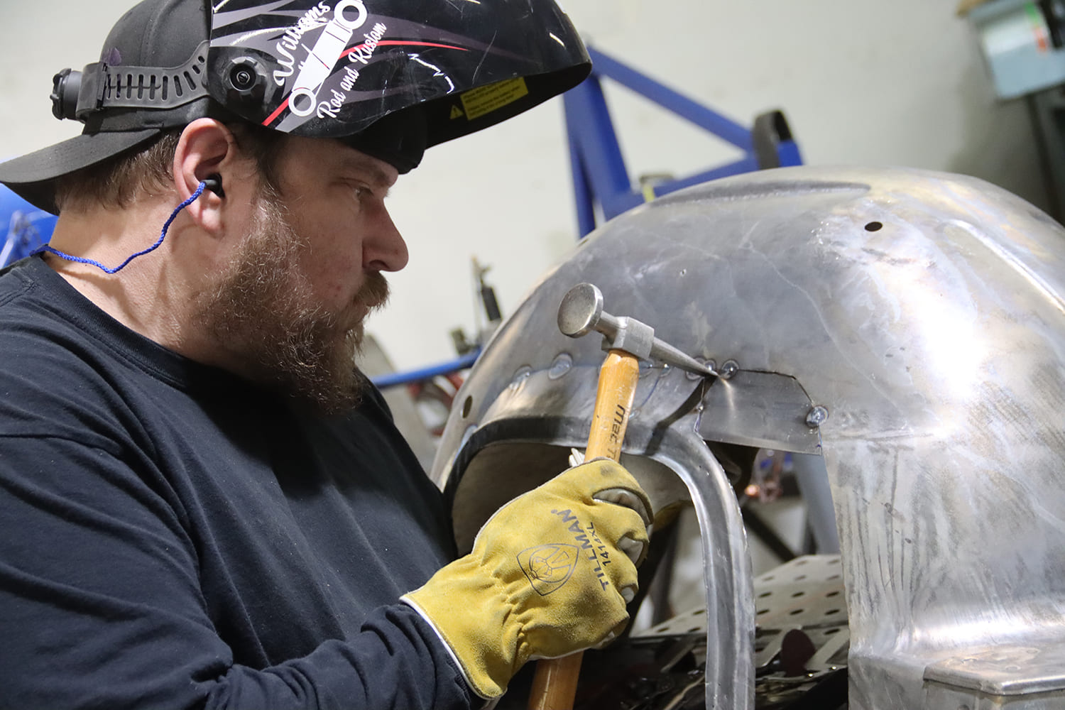 21 1967 Firebird wheel tub patch being hammer formed to contour flush with factory metal before welding